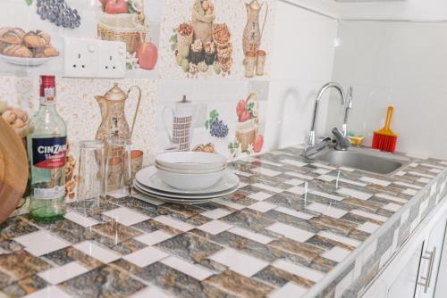 a kitchen with a counter top with a sink at Ella RV Heaven World Hotel in Ella