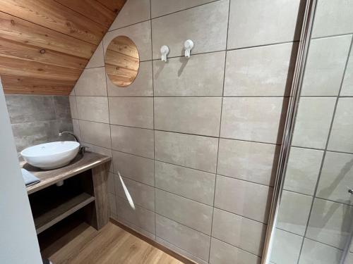a bathroom with a sink and a mirror at le saint genest in Vallouise