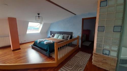 a bedroom with a bed and a window at Ameli House By PECA in Silleda