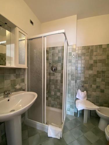 a bathroom with a shower and a sink at Locanda Cà de Rusitta in Vezzi Portio