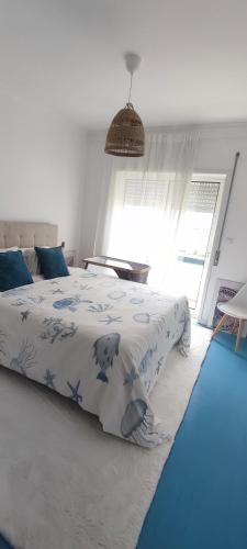 a bedroom with a bed and a swimming pool at Azurara Beach Nest in Azurara