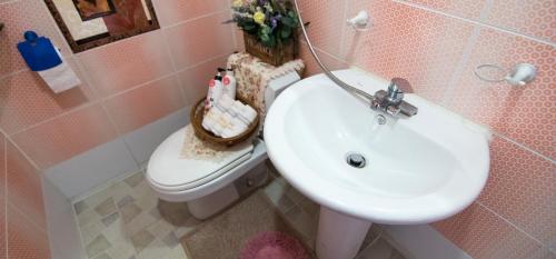 a bathroom with a sink and a toilet at Heidi Korea in Hongcheon