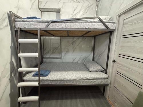 a couple of bunk beds in a room at Pariss Library Hostel in Yerevan