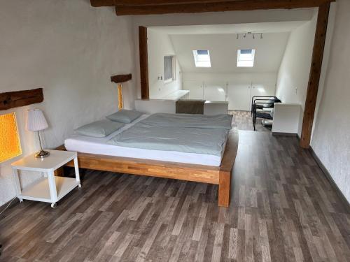 a bedroom with a large bed in a room at Ruhige 2 Zimmer Wohnung in Diegten