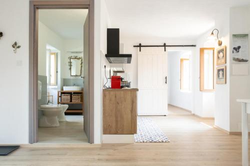 an open hallway with a bathroom with a toilet at Casa La Barancina in Cittiglio