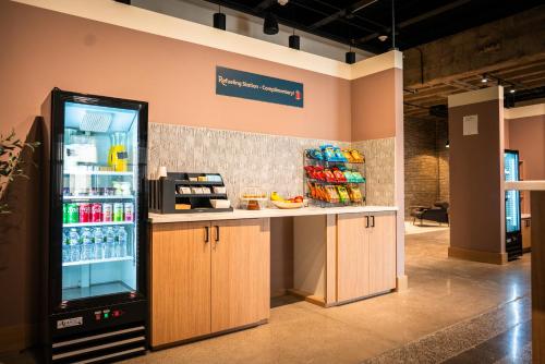 a store with a refrigerator filled with drinks at Roami at Century Plaza in Minneapolis