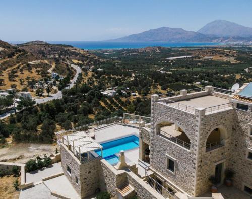 an image of a villa with a swimming pool at Villa Ovgoro - Luxury 3-Level Villa with Heated Pool, Jacuzzi and Panoramic Views in Kamilari
