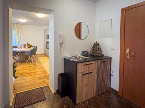 a room with a counter and a hallway with a door at Lake View in Fužine