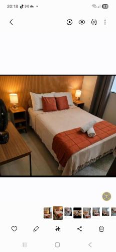 a bedroom with a bed with two tables and two lamps at Casa Tranquila em Diamantina in Diamantina