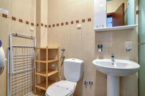 a bathroom with a toilet and a sink at Garni Hotel Milica in Herceg-Novi
