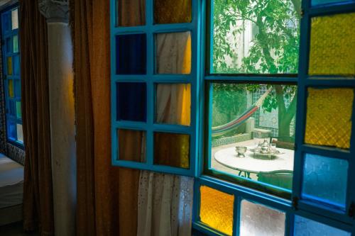 a window with a view of a bathroom sink at Dar El Rezk in Tunis