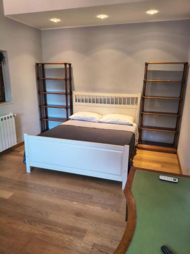 a bedroom with a bed and a pool table at Casa Daniela in Velletri