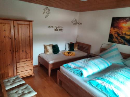 a bedroom with a bed and a desk in it at Apartment Meyerhof in Schwanau
