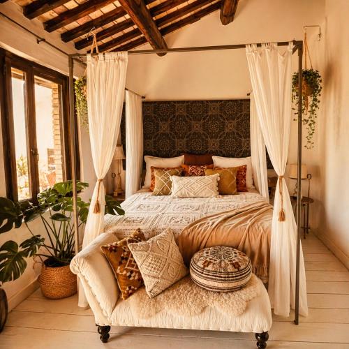a bedroom with a large bed with a canopy at Appartamento con Vista Mare e Piscina a Casa Vuscichè in Roseto degli Abruzzi
