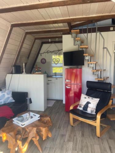 a living room with a table and a couch at Ferienhaus nähe Warnemünde 6 in Elmenhorst