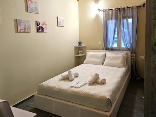 a bedroom with a bed with two towels on it at Elia Paradise Villa with private Pool in Heraklio