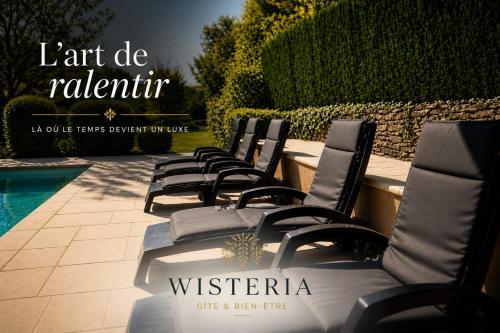 a row of chairs sitting next to a pool at Wistéria #Piscine #Terrasse privée #Route des vins in Azé
