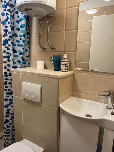 a small bathroom with a toilet and a sink at Villa More in Pučišća