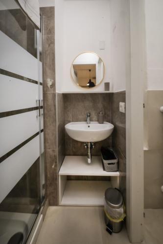a bathroom with a sink and a mirror at Civico46 in Domodossola
