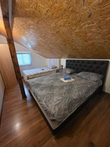 a bedroom with two beds in a attic at Apartment Perović in Kotor