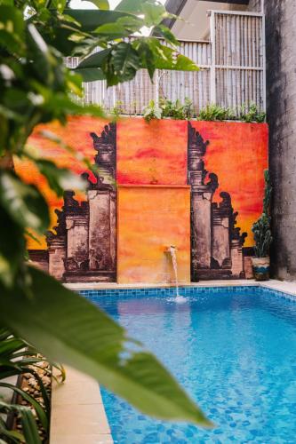 a mural on a wall next to a swimming pool at Modern Villa near Seminyak & Canggu, Large Pool in Kerobokan