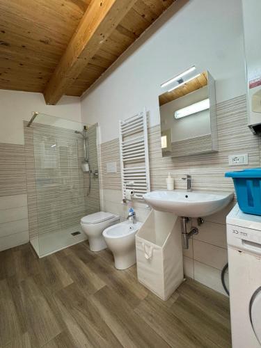a bathroom with a sink and a toilet and a shower at Dimora Marisa in Termoli