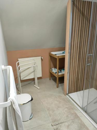 a bathroom with a shower with a toilet and a chair at Chez YEP, 4 chambres 9 couchages in Anzin-Saint-Aubin