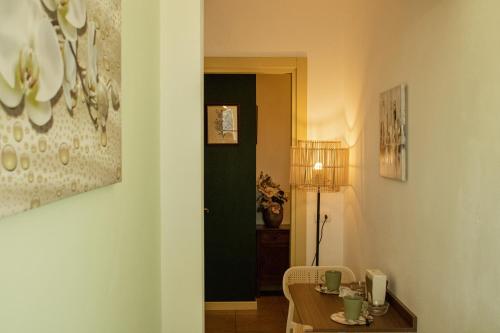 a room with a table and a room with a dining room at Ai tre camini in Adro