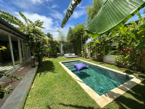 a swimming pool in the yard of a house at BaraJade Villas in Uluwatu