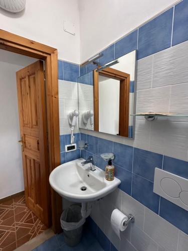 a bathroom with a sink and a mirror at Villa Egidio Terrazza in Sant'Angelo D'Ischia