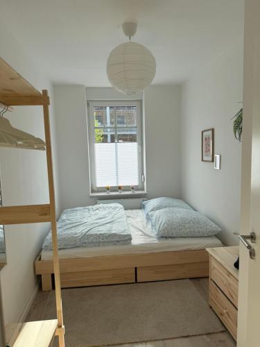a bedroom with a bunk bed and a window at NEU Apartment Lotta in Senftenberg
