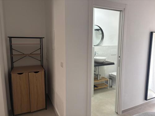 a bathroom with a sink and a mirror at Poggio sul Mare in Alberese