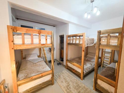 a group of bunk beds in a room at Hotel Restaurant Ujimira in Radomirë
