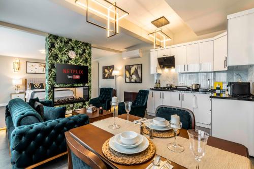 a living room with a couch and a table at Bellavia Deluxe Apart in Istanbul