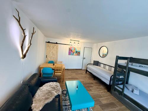 a living room with a couch and a bunk bed at Maria Altreichenau in Neureichenau