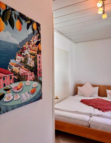 a bedroom with a painting of a table with food on it at Hamburg Living Hub in Pinneberg