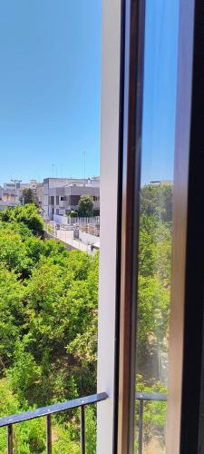 a view from a train window of a city at Alighieri Rooms in Triggiano