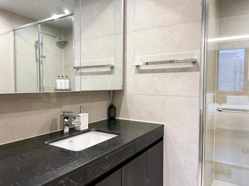 a bathroom with a sink and a shower at Stay in MooD in Busan