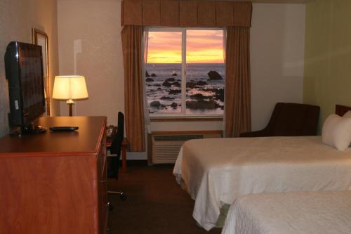a hotel room with two beds and a window at Oceanfront Lodge in Crescent City