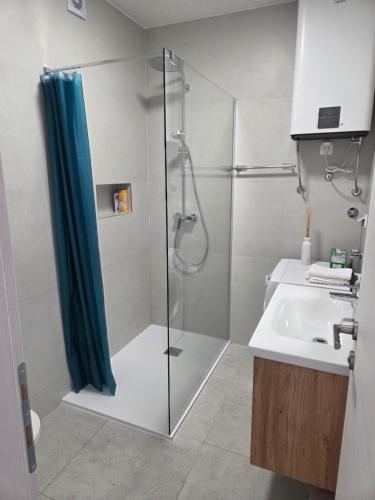 a bathroom with a shower and a sink at Apartment Jakov i Lucija - Sea View Terrace & FREE PARKING in Dubrovnik