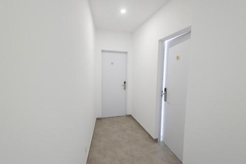 an empty room with a door and a hallway at lovely cityscape in Lagos