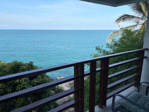 a balcony with a view of the ocean at Noahs Ark Beach in Nathon Bay