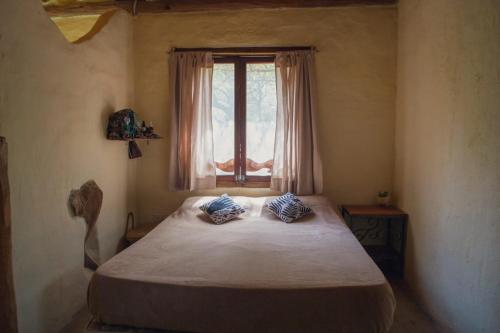 Un pat sau paturi într-o cameră la Casa de duendes