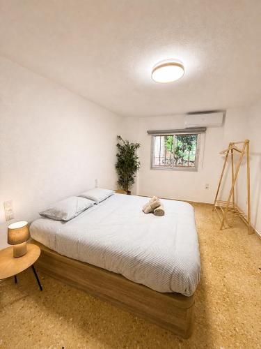 a bedroom with a large bed and a window at El refugio de NaRo in Chella