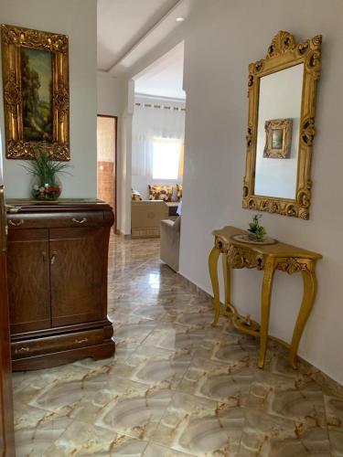 a room with a dressing table and a mirror at Azla Beach Escape - Cozy Apartment in Tétouan