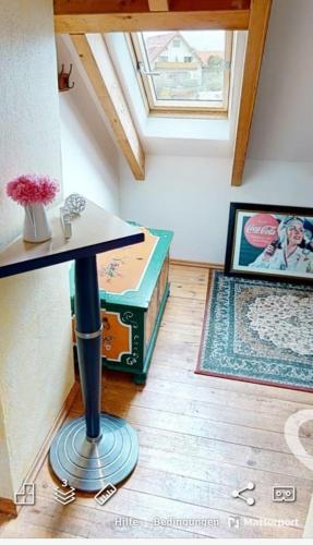 a room with a table in a room with a window at Dia Mare Taubenschlag in Ueckeritz