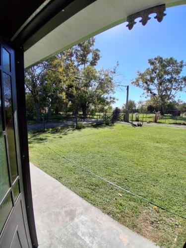 a view of a field from the door of a house at Los Eucaliptos in Duggan