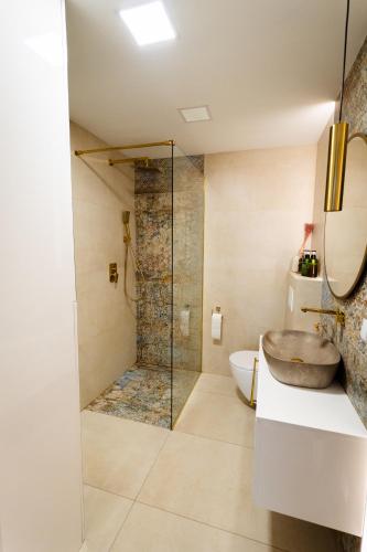 a bathroom with a sink and a shower at SoboLove in Sobolów