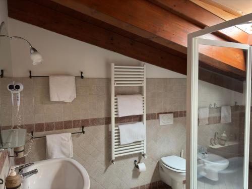 a bathroom with a sink and a toilet at Antica Interamnia in Teramo