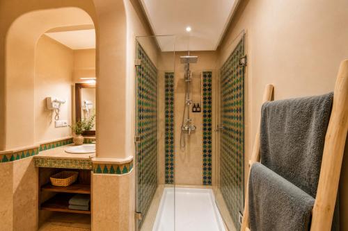 a bathroom with a shower and a sink at Babylone Appart & Pool, Hivernage in Marrakesh